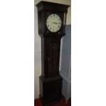A 19th century stained and relief carved oak long case clock, the repainted circular dial signed J