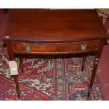 A circa 1900 mahogany bowfront single drawer side table on turned supports, width 75cm