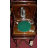 An early 20th century mahogany cased hinge topped gramophone table, enclosing 'The Salon' sound-box,