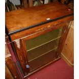 A Victorian figured walnut, satinwood inlaid, and gilt metal mounted single door glazed pier