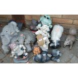 A collection of various garden ornamental animal figures