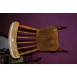 A set of five early 20th century elm and beech stickback kitchen chairs