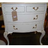 A contemporary French white wood low chest, of three long drawers, raised on acanthus capped and