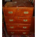 A late 19th century mahogany flush brass handled campaign chest of four long drawers, raised on