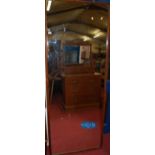 An early 20th century stained walnut framed rectangular wall mirror of good size, 183 x 71cm