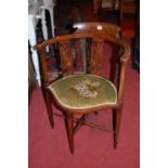 An Edwardian mahogany tub elbow chair with pierced splatbacks and fixed floral pad seat, width 57cm