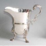 A late Victorian silver milk jug, in the mid-18th century style, having acanthus leaf capped