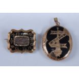 A yellow metal mourning brooch and locket, the shield shaped brooch having a scalloped edge and