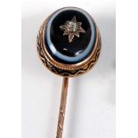 A yellow metal banded agate and diamond mourning stick pin, comprising a 16 x 12.6mm banded agate