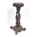A circa 1900 Burmese carved hardwood jardinière stand, the column modelled as a bird entwined in