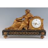 A mid-19th century French gilt bronze and grey marble mantel clock 'Pendule a la Geoffrin' after