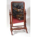 A Victorian mahogany cheval mirror, the rectangular plate in an ogee moulded frame, raised on ring