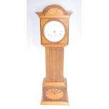 A 19th century miniature longcase clock, the rosewood case inlaid with ebony and satinwood, having a