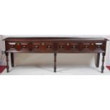 An antique joined oak dresser base, of good proportions, having four geometric moulded drawers and
