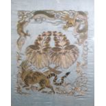 A Chinese embroidery and gold thread on silk panel, depicting a tiger warding off a three-clawed