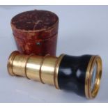 A late 19th century lacquered brass black composition three-drawer monocular, stamped Bodson, Palais