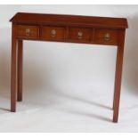 A George III style mahogany hall table, of narrow proportions, fitted with four short drawers,