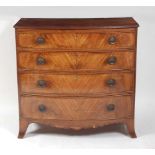 A Regency mahogany bowfront chest, the top with boxwood stringing, having a reeded edge over four