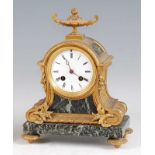 A late 19th century French gilt bronze and verdigris marble mantel clock, in the Louis XVI style,