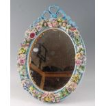A 19th century Meissen porcelain easel dressing table mirror, the circular plate with ribbon