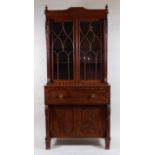 A Regency mahogany secretaire bookcase, the upper section having twin astragal glazed doors within