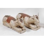 A large pair of South East Asian painted and carved hardwood recumbent Oxen, length 72cm, h.38cm