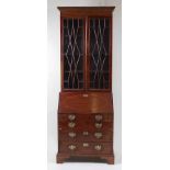 *An early George III mahogany bureau bookcase, of narrow proportions, having a replacement dentil