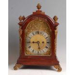 An Edwardian mahogany and gilt brass mounted bracket clock, having an unsigned brass dial with