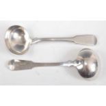 A pair of George III silver sauce ladles, in the Fiddle pattern, having armorial engraved terminals,