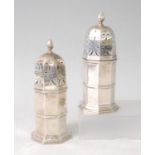A pair of late Victorian silver lighthouse sugar casters, each having flaming torch finial topped