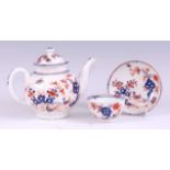 A Lowestoft porcelain bullet shaped teapot and cover, decorated in the Redgrave pattern and