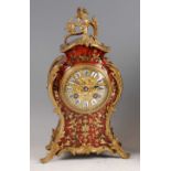 A 19th century French boulle and gilt metal mounted balloon shaped mantel clock, the case with cut