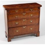 *A George II figured walnut bachelors chest, having a fold-over top above two short and three long