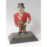 A late 19th century cast iron mechanical figural cigar cutter in the form of a singing man,