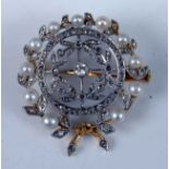 An Edwardian yellow and white metal, pearl and diamond circular wreath brooch, featuring an openwork