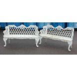 A pair of Victorian cast iron and white enamelled garden benches by Carron, each having arcaded