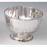 An Edwardian silver footed bowl, of half spiral reeded and fluted circular form, 11.3oz, maker