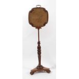 A Regency rosewood and brass inlaid pole screen, having rise-and-fall action, tapestry inset