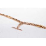 A Victorian 9ct gold Figaro link watch chain with T bar, joined in two sections, the T bar on