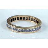 An 18ct yellow gold diamond full hoop eternity ring, featuring thirty-three Princess cut diamonds in