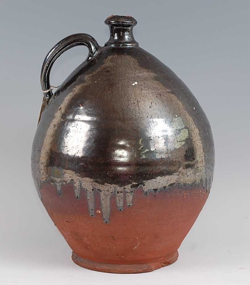 An early 19th century earthenware bellamine jug, of typical form, having silver lustre drip glaze, - Image 3 of 5