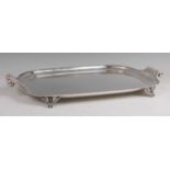 A circa 1900 silver plated twin handled tray, having acanthus leaf cast scroll ends and raised egg &