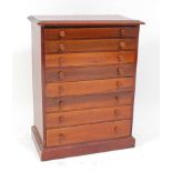 A Victorian mahogany flight of eight collectors drawers, each being graduated, having turned