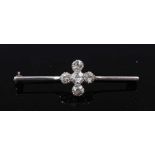 An early 20th century white metal diamond bar brooch, comprising a cinquefoil cluster of Old
