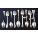 A collection of George III and later silver dessert spoons, many with monogrammed or crested