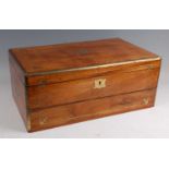A mid-19th century camphor wood and brass bound campaign fitted writing box, having fold-out action,