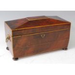 A Regency mahogany and boxwood strung tea caddy, of sarcophagus form, having partitioned interior