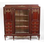 A circa 1900 French mahogany and gilt bronze mounted breakfront side cabinet, the glazed centre