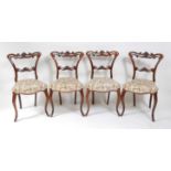 A set of four Victorian rosewood salon chairs, each having swept backs, stuffover serpentine