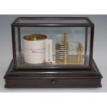 An early 20th century oak cased barograph, having clockwork drum with lacquered brass mechanism